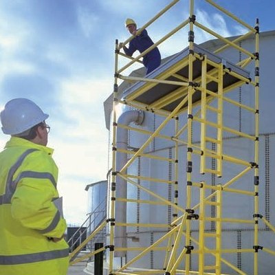 A Fibreglass (GRP) Scaffold Tower being used by two workers to safely work at height.