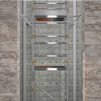 A lift shaft  scaffold tower in a confined space.