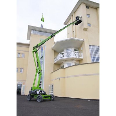 A Nifty HR21 Bi Energy / Hybrid Boom Lift - Articulated being used on a house.