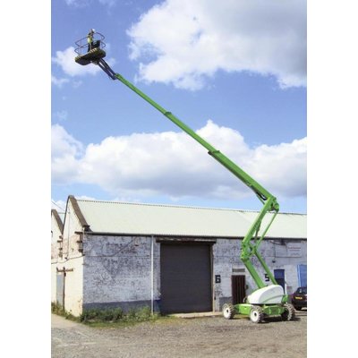 A boom lift being used on an agricultural site.