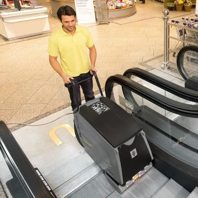 A Karcher BR 47/35 Escalator Cleaner being used to clean an escalator.