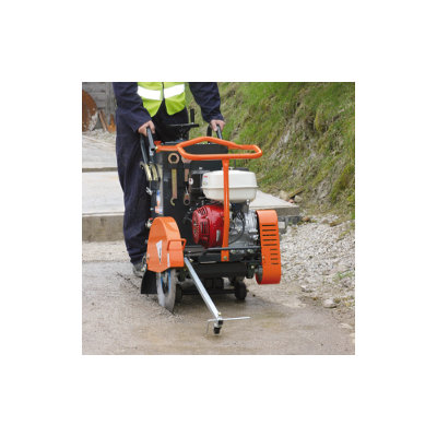 A Floor Saw Petrol - 450mm being operated by a person wearing a high vis jacket.