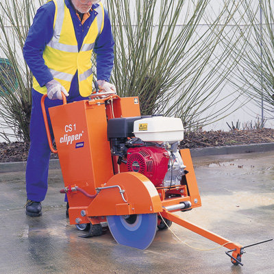 A Floor Saw Diesel - 450mm being operated outdoors.