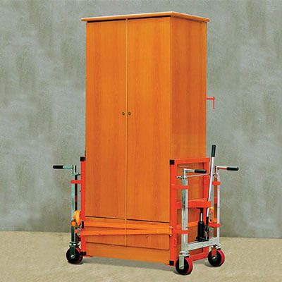 A Hydraulic Furniture Mover being used to move a wardrobe.