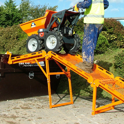 A Skip Ramp for Muck Truck being used to load rubbish into a skip.