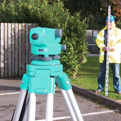 A rotating laser level, being used outdoors.